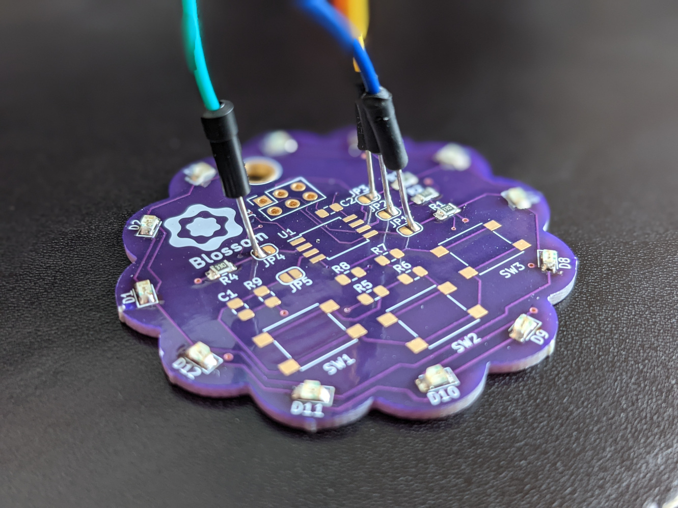 Jumpers soldered to the pads of the solder bridges